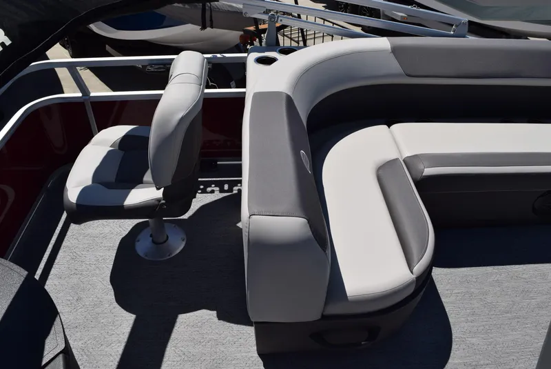 Slide: The Image of 2026 Sun Tracker Bass Buggy 18 DLX interior with gray seating and carpeted floor. - 5