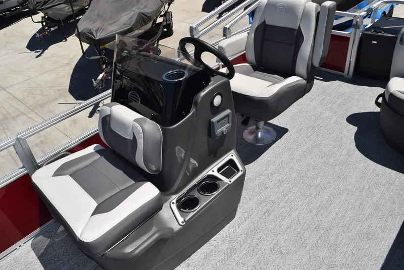 Slide: The Image of 2026 Sun Tracker Bass Buggy 18 DLX interior with steering console and seating. - 7