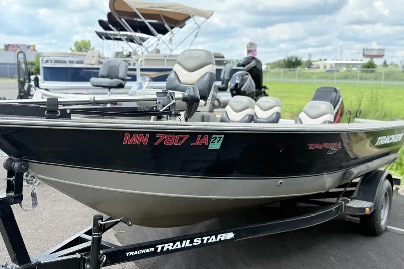 Slide: The Image of 2000 Tracker Targa 17 boat on trailer, parked outdoors. - 3