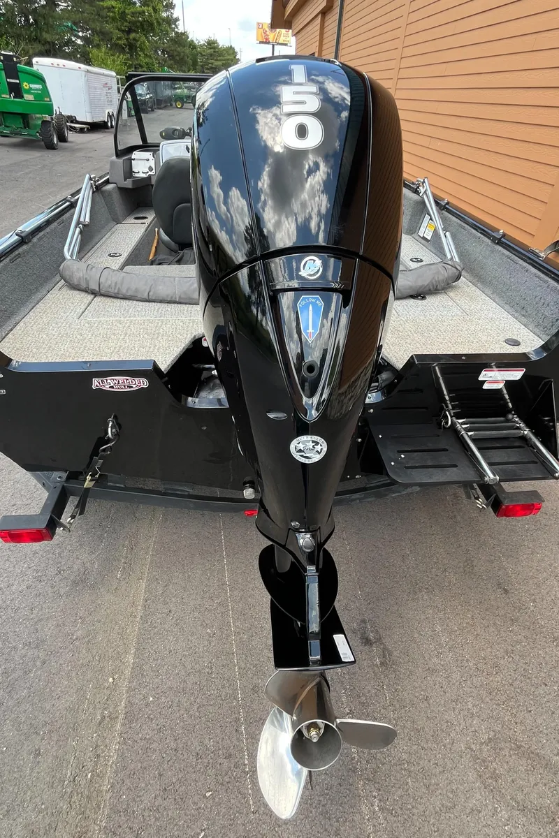 Slide: The Image of 2023 Tracker Pro Guide V-175 Combo boat with a 150 HP outboard motor. - 2