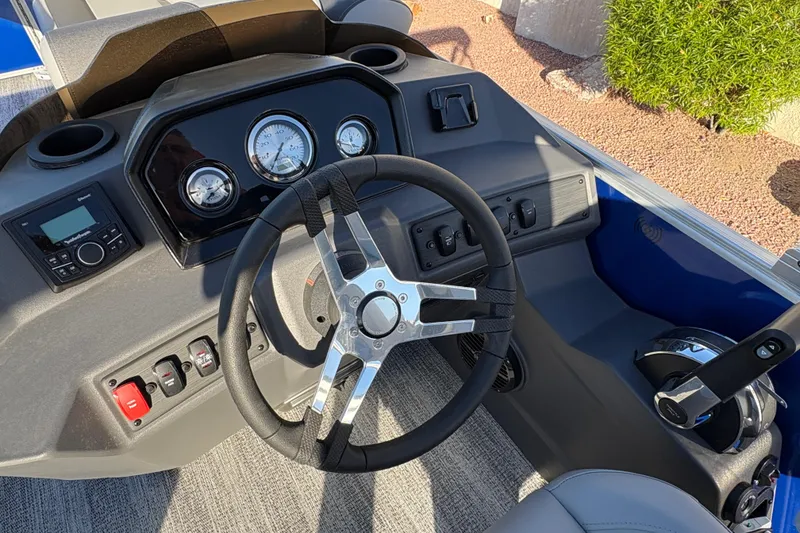Slide: The Image of 2026 Bennington 21 SSR boat dashboard with steering wheel and control panel. - 10