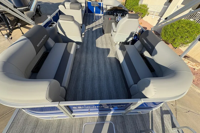 Slide: The Image of 2026 Bennington 21 SSR pontoon boat interior with gray seating and modern design. - 11