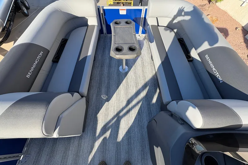 Slide: The Image of 2026 Bennington 21 SSR pontoon boat interior with gray seating and central table. - 8