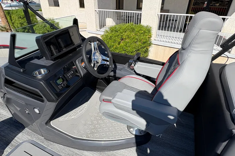 Slide: The Image of 2026 Bennington 22 MFB boat interior with modern steering console and comfortable seating. - 10