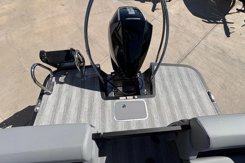 Slide: The Image of 2026 Bennington 22 MFB boat with Mercury engine and gray deck flooring. - 17