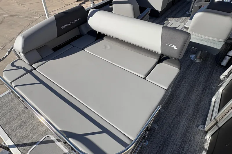 Slide: The Image of 2026 Bennington 21 SSB boat interior with gray cushioned seating and sleek design. - 10