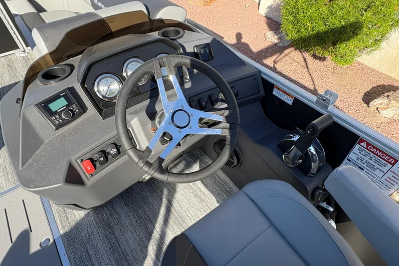 Slide: The Image of 2026 Bennington 21 SSB boat dashboard with steering wheel and control panel. - 11