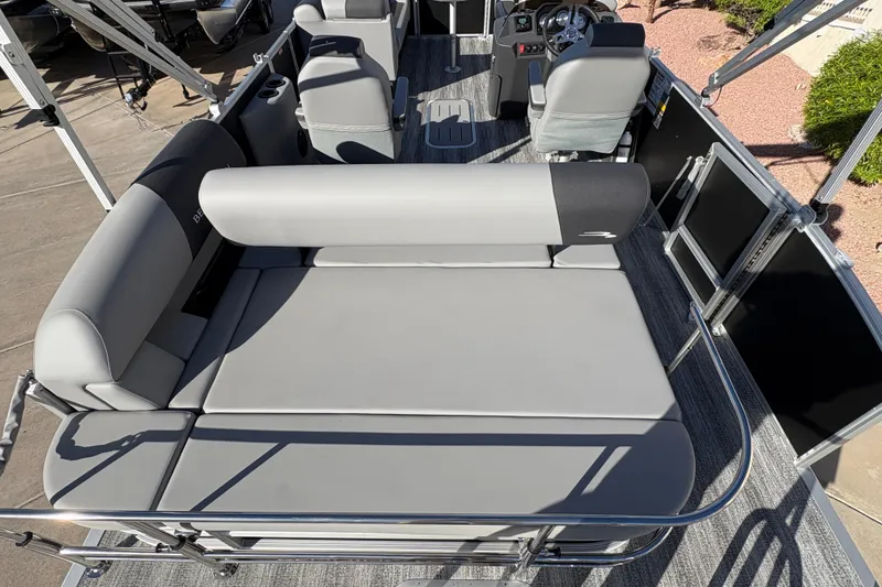 Slide: The Image of 2026 Bennington 21 SSB pontoon boat interior with gray seating and steering console. - 12