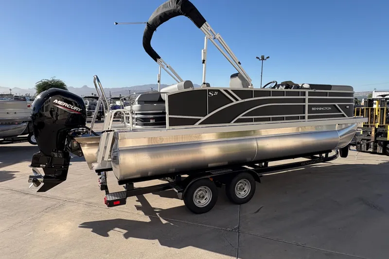 Slide: The Image of 2026 Bennington 21 SSB pontoon boat on trailer with Mercury outboard motor. - 2
