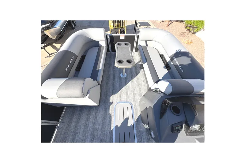 Slide: The Image of Interior of 2026 Bennington 21 SSB pontoon boat with gray seating and table. - 7