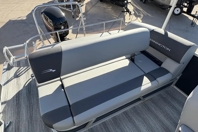 Slide: The Image of 2026 Bennington 21 SSB boat with gray seating and Mercury outboard motor. - 9