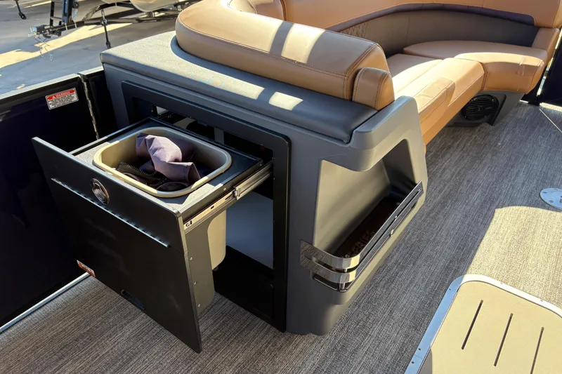 Slide: The Image of 2026 Bennington 24 MFB boat interior with seating and storage compartment. - 11