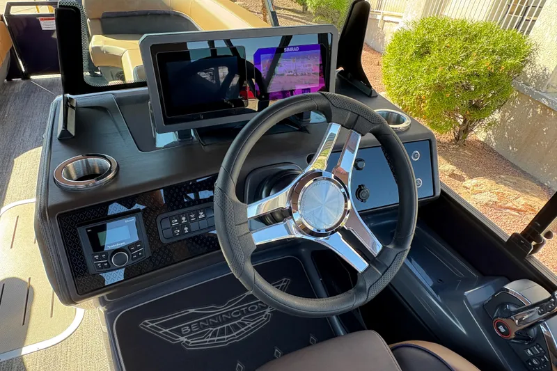 Slide: The Image of 2026 Bennington 24 MFB boat interior with seating and storage compartment. - 12