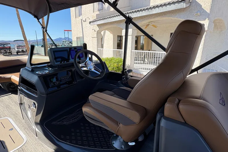 Slide: The Image of 2026 Bennington 24 MFB boat interior with storage compartment and seating. - 13