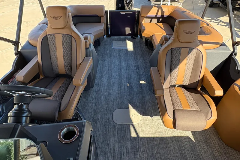 Slide: The Image of 2026 Bennington 24 MFB boat dashboard with steering wheel and digital displays. - 14