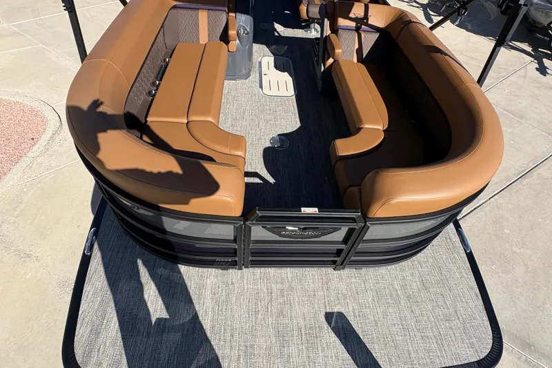 Slide: The Image of 2026 Bennington 24 MFB pontoon boat with powerful outboard motor, docked under clear skies. - 4