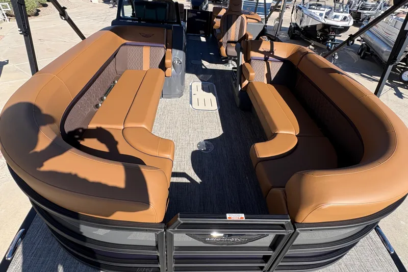 Slide: The Image of 2026 Bennington 24 MFB pontoon boat with Mercury outboard engine on trailer. - 5