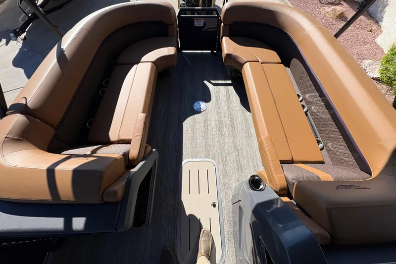 Slide: The Image of 2026 Bennington 24 MFB pontoon boat with luxurious brown seating and spacious deck. - 6