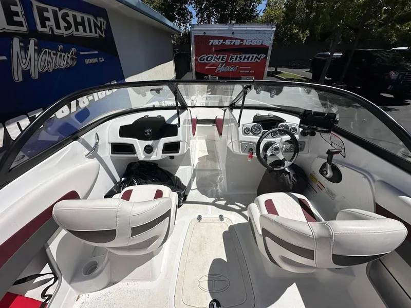 Slide: The Image of Interior of a 2018 Tahoe 500 TF boat with white and red seating. - 16
