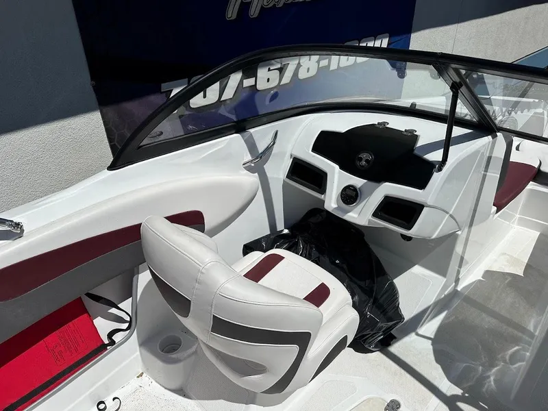Slide: The Image of Interior of a 2018 Tahoe 500 TF boat with white and maroon seating. - 17