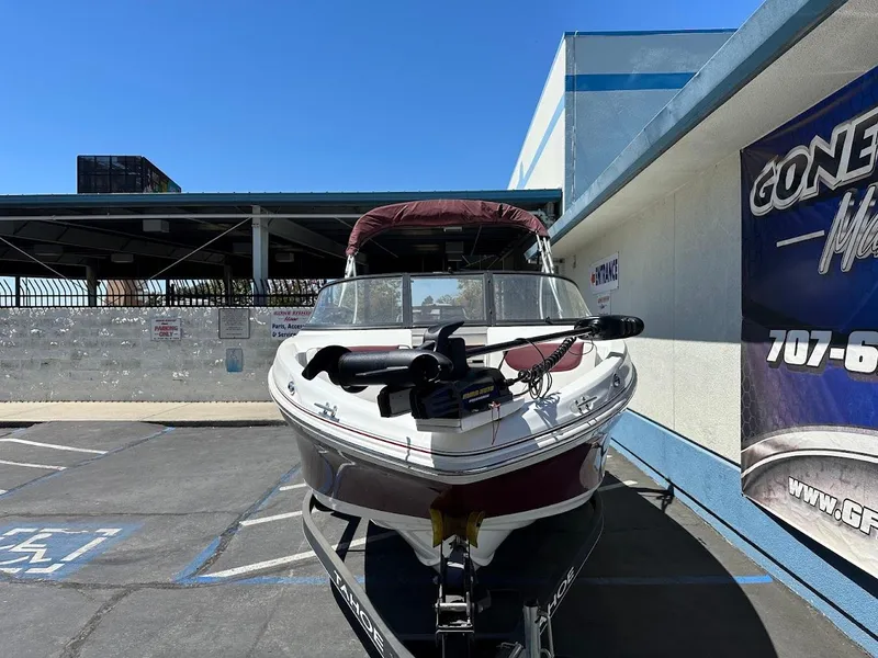 Slide: The Image of 2018 Tahoe 500 TF boat on trailer in parking lot, sunny day. - 2