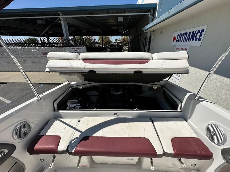 Slide: The Image of 2018 Tahoe 500 TF boat interior with open engine compartment, white and maroon seating. - 30