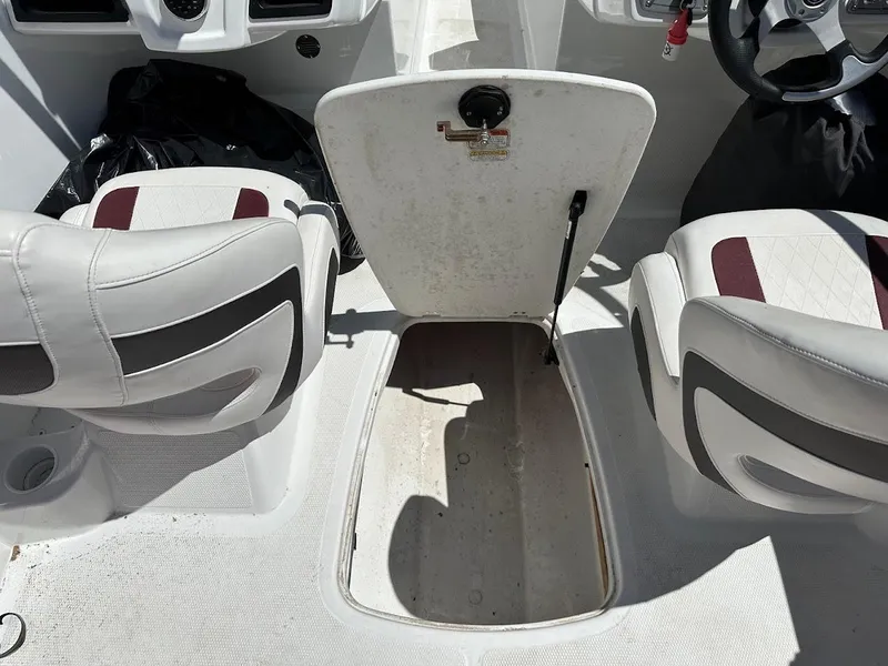 Slide: The Image of Interior of 2018 Tahoe 500 TF boat showing storage compartment and seating. - 35