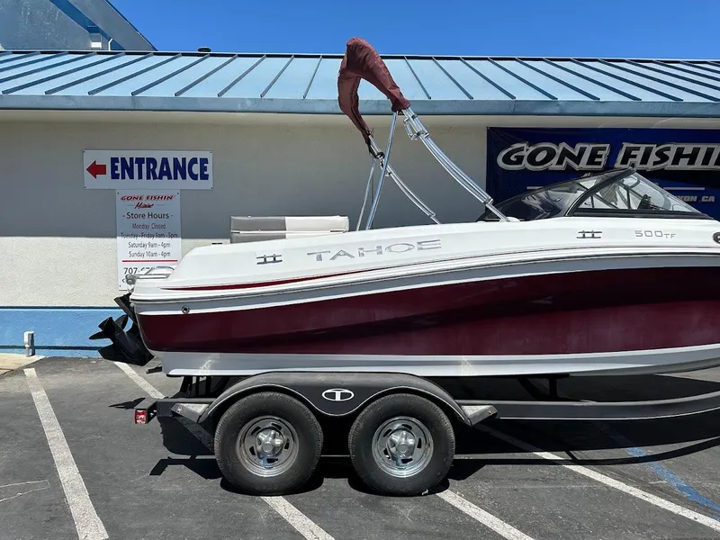 Slide: The Image of 2018 Tahoe 500 TF boat on trailer, parked outside a fishing store. - 7