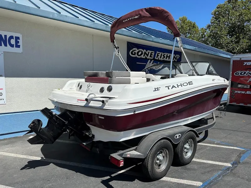 Slide: The Image of 2018 Tahoe 500 TF boat on trailer, parked outdoors near a building. - 8