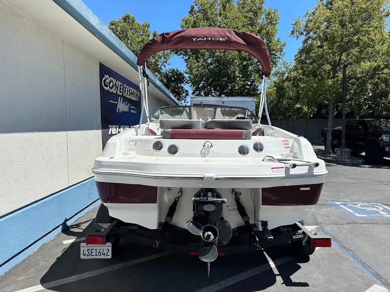 Slide: The Image of 2018 Tahoe 500 TF boat on trailer, parked outdoors near a building. - 9