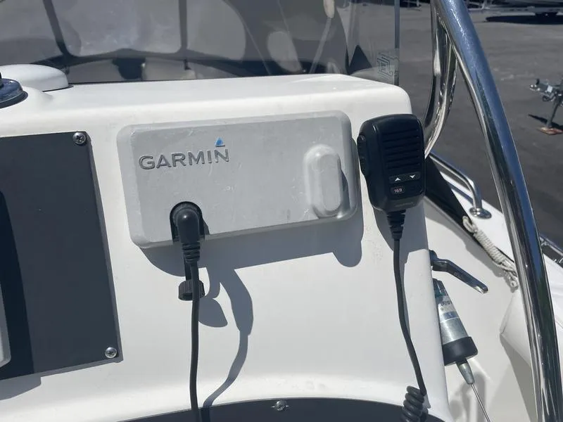 Slide: The Image of Garmin device and microphone on 2006 Boston Whaler 210 Outrage boat console. - 10