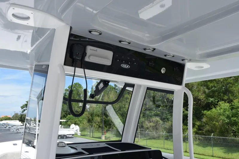 Slide: The Image of 2026 Sea Hunt Gamefish 28 Forward Seating boat interior with Garmin electronics. - 10
