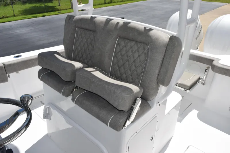 Slide: The Image of 2026 Sea Hunt Gamefish 28 Forward Seating with plush, gray cushioned seats. - 11