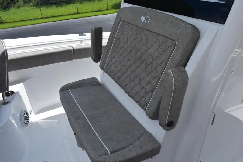 Slide: The Image of 2026 Sea Hunt Gamefish 28 Forward Seating with gray cushioned seat and armrests. - 13