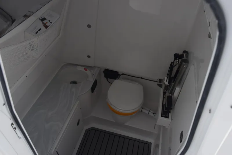 Slide: The Image of Interior of 2026 Sea Hunt Gamefish 28 boat bathroom with toilet and sink. - 15
