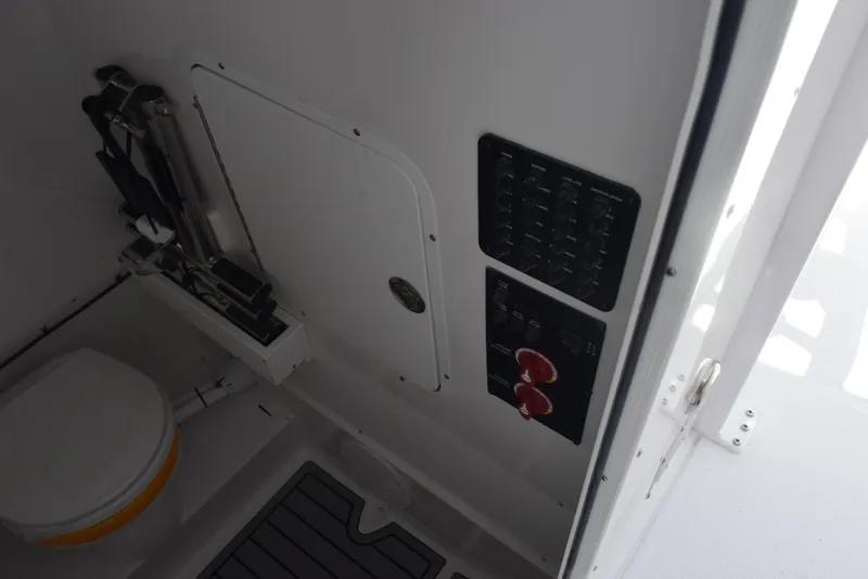 Slide: The Image of Interior of 2026 Sea Hunt Gamefish 28, featuring control panel and seating area. - 17