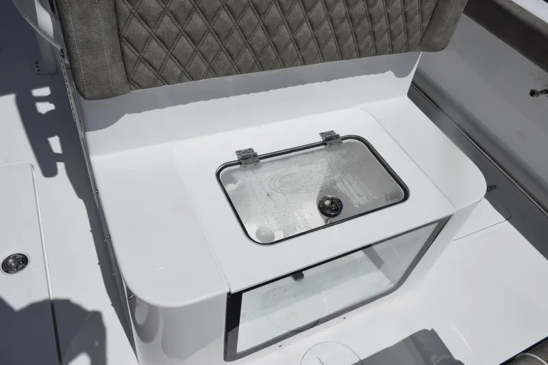 Slide: The Image of 2026 Sea Hunt Gamefish 28 Forward Seating livewell with cushioned backrest. - 23