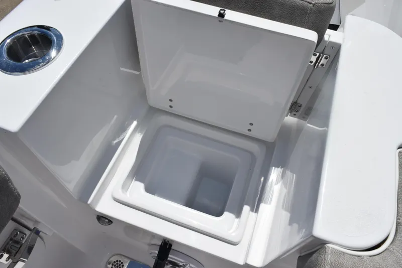 Slide: The Image of 2026 Sea Hunt Gamefish 28 Forward Seating boat storage compartment with open lid. - 26