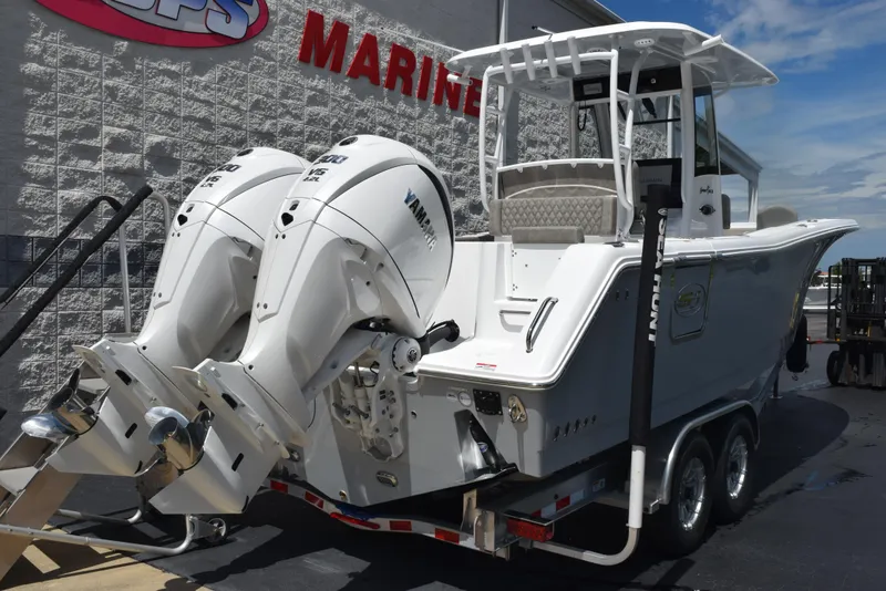 Slide: The Image of 2026 Sea Hunt Gamefish 28 with dual Yamaha engines on a trailer. - 3