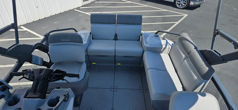 Slide: The Image of 2023 Sea-Doo Switch Sport Compact interior with gray seating and steering console. - 12