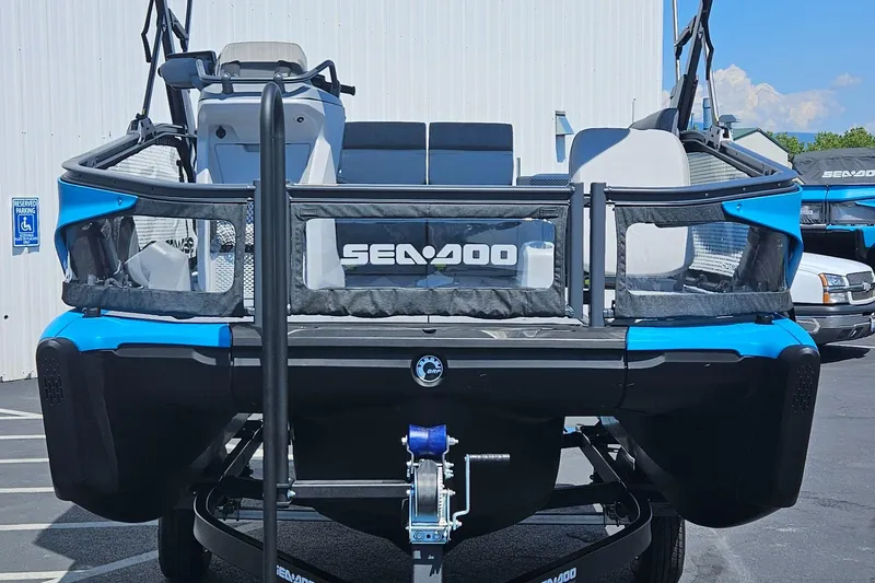 Slide: The Image of 2023 Sea-Doo Switch Sport Compact, blue and black, parked on trailer. - 16