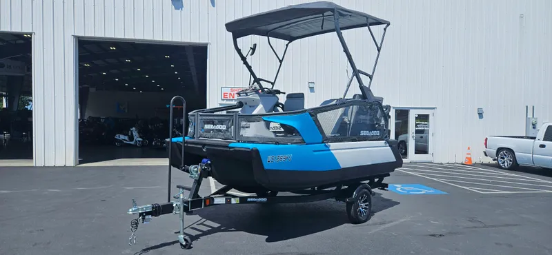 Slide: The Image of 2023 Sea-Doo Switch Sport Compact boat on trailer outside a warehouse. - 6