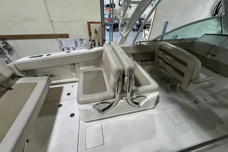 Slide: The Image of 2022 Boston Whaler 320 Vantage interior with seating and helm, showcasing luxury design. - 13