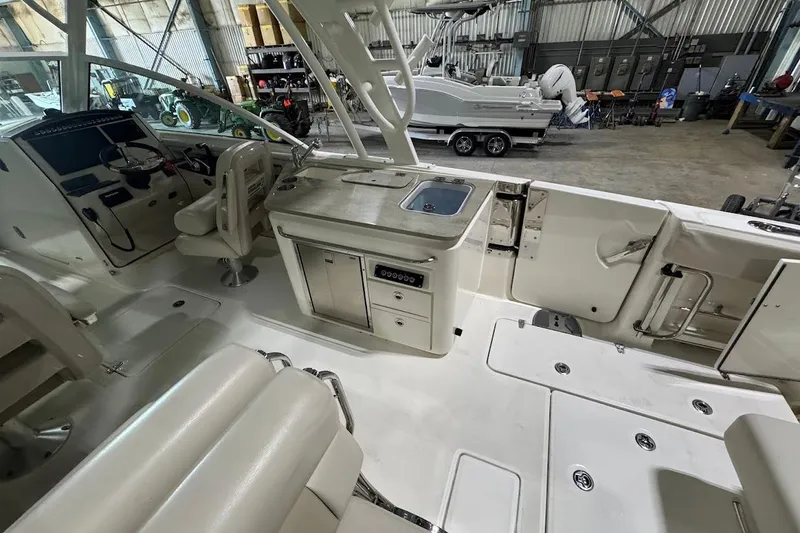 Slide: The Image of Interior view of a 2022 Boston Whaler 320 Vantage boat in a storage facility. - 16