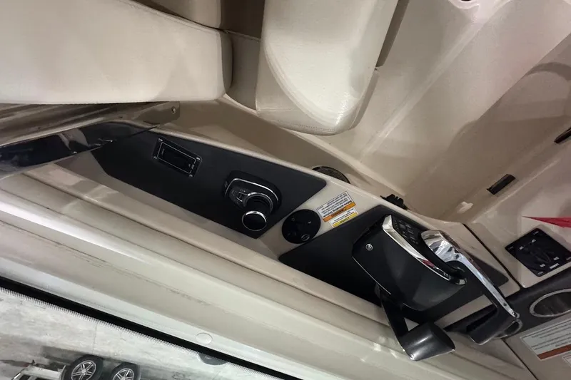 Slide: The Image of 2022 Boston Whaler 320 Vantage boat interior controls and seating area. - 17