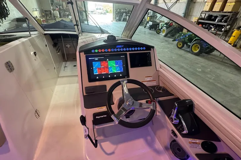Slide: The Image of Interior view of 2022 Boston Whaler 320 Vantage boat cockpit with navigation system. - 20