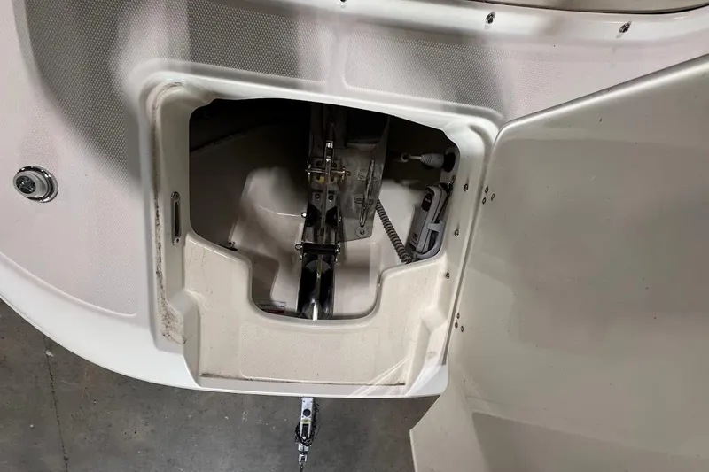 Slide: The Image of 2022 Boston Whaler 320 Vantage boat compartment detail with visible hardware and wiring. - 26