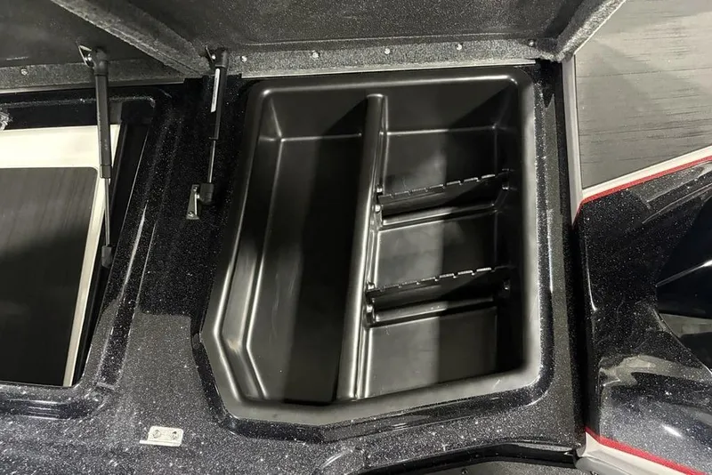Slide: The Image of Open storage compartment in 2026 Skeeter ZXE20 boat, featuring organized interior sections. - 15