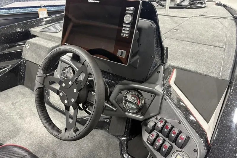 Slide: The Image of 2026 Skeeter ZXE20 boat dashboard with steering wheel and control panel. - 16