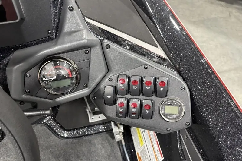 Slide: The Image of Dashboard controls of a 2026 Skeeter ZXE20 boat, featuring gauges and switches. - 21